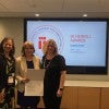 Maria Corcuera and Adria Baker of Rice OISS receive award from IIE's Michelle Pickard.