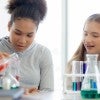 High school girls conducting a science experiment.