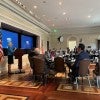 Photo of participants attending “AI in Postsecondary Education Working Session: Advancing AI Together,” an event hosted by the U.S. Department of Education at the Eisenhower Executive Office Building in Washington June 17. Participants are pictured at a roundtable in the EEOB.