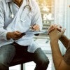 Doctor visiting with patient