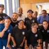 Rice President Reginald DesRoches takes a group picture at the Genuine World Cup Connect event Aug. 1, 2024.