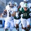 Dean Connors runs away from a defender during a Rice football game.