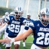 Rice football team runs out onto the field