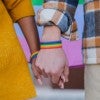 A couple holding hands. Credit: Adobe Stock.