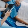 Photo of patient in hospital bed