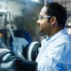 Pramanik examining a battery prototype. 