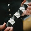 Larissa Novelino holds an origami structure