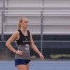 A Rice women's soccer player wears a tracker vest at practice.