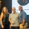 Brian Gibson receives the Gillis Award from Jessica Keithan and President Reginald DesRoches.
