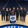 Rice University sport management students pose with the South Regional trophy at Toyota Center, where they worked as court attendants during the Sweet 16 and Elite 8. Photo courtesy of Jacob Lozano