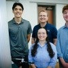 The group of researchers poses for a picture in the lab.  