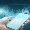 Sound waves over hand holding a smartphone 