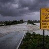 Stock image of flash flooding across a roadway 