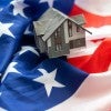 American flag with small house - homeownership