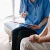 Medical professional consults with patient 