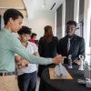 Students from the SEED program show off their designs.  