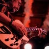 Aurum Son playing guitar 
